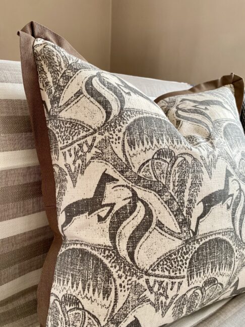 A Springbok print cushion design in monochrome depicting the African bush landscape.