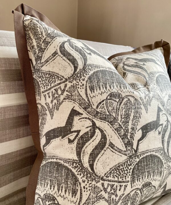 A Springbok print cushion design in monochrome depicting the African bush landscape.