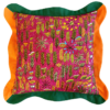 Multi-coloured cushions with a pink botanical print on linen and green and orange scalloped trim.
