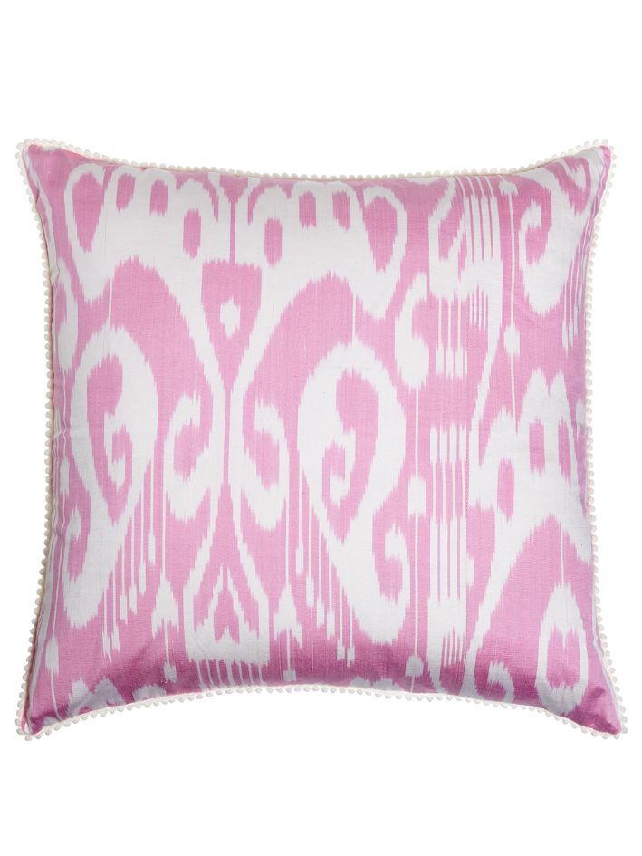 A baby pink silk Ikat cushion.