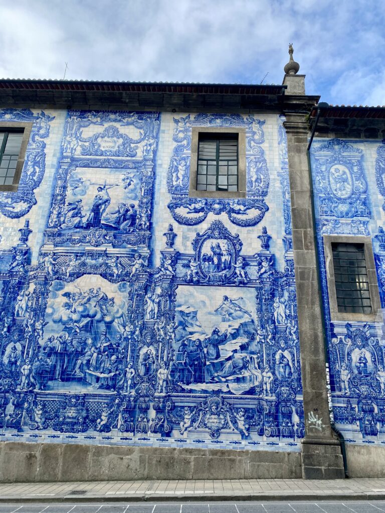 The exquisitely tiled facade of the Capela Das Almas near Rua Santa Caterina in Porto, Portugal.