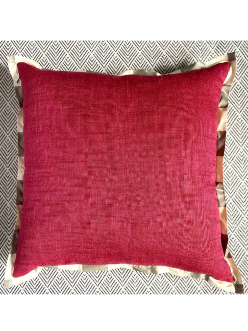 The reverse of a country floral cushion cover in red weave with neutral silk trim.