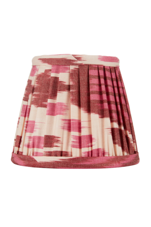 A burgundy silk candle shade in an Ikat design.