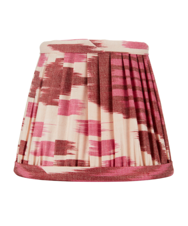 A burgundy silk candle shade in an Ikat design.