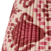 A burgundy silk lampshade with an Ikat design.