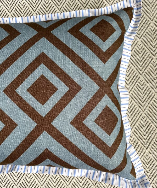 Geometric linen print reverse of a cushion in blue and brown.