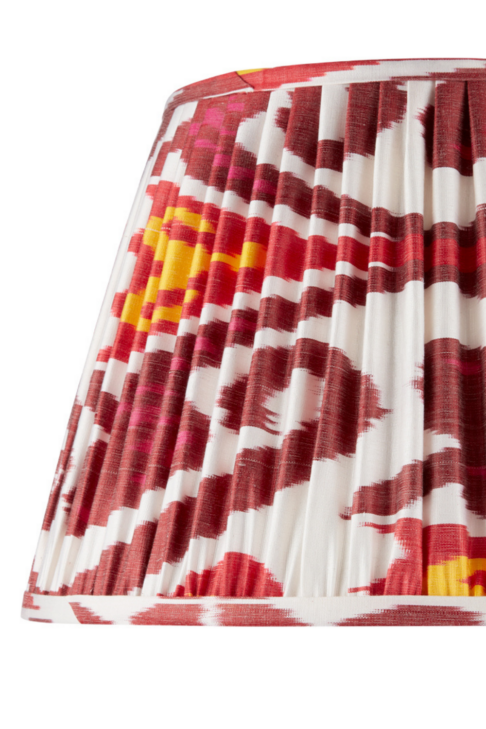 Burgundy red silk Ikat lampshades with yellow accents.