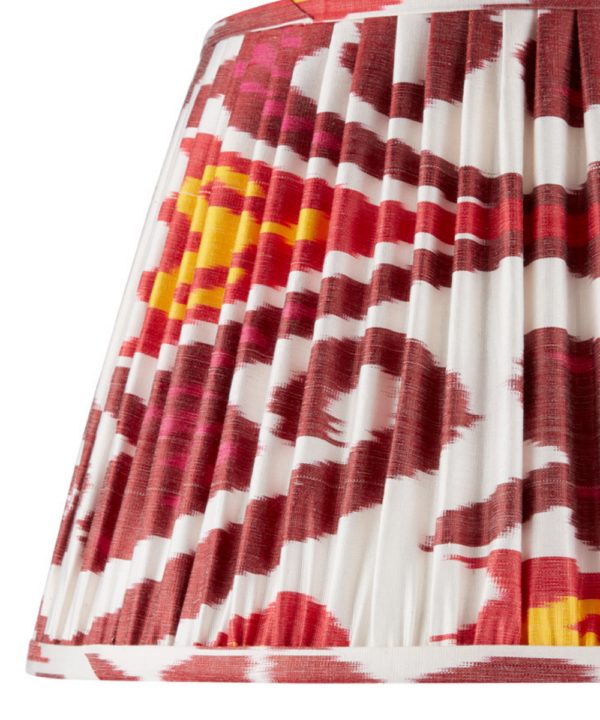 Burgundy red silk Ikat lampshades with yellow accents.