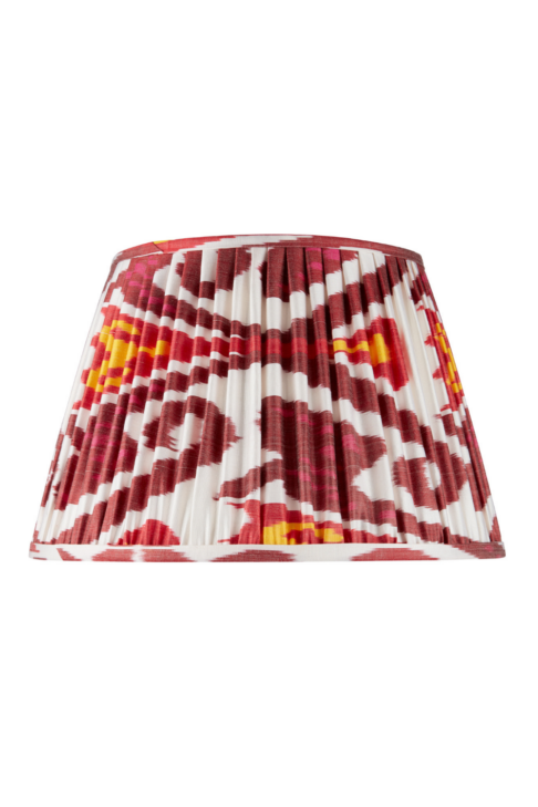 Deep red silk Ikat lampshades with yellow and white accents.