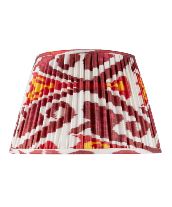 Deep red silk Ikat lampshades with yellow and white accents.