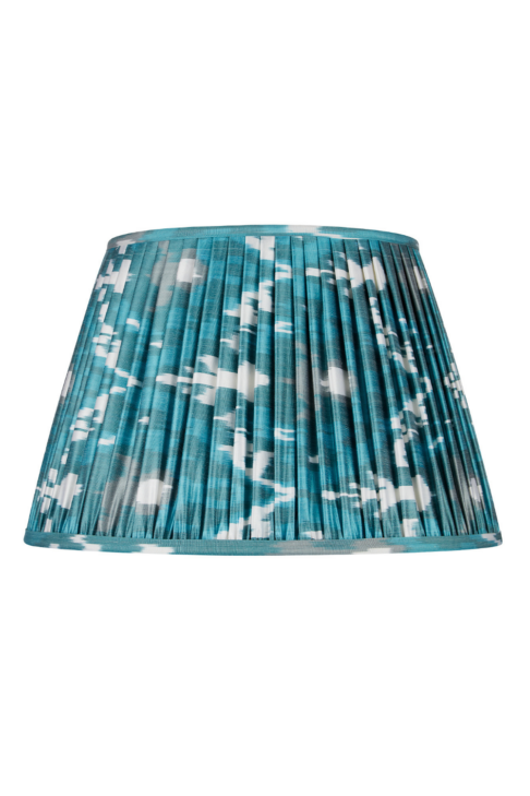 Teal silk Ikat lampshades with gathered fabric detailing.