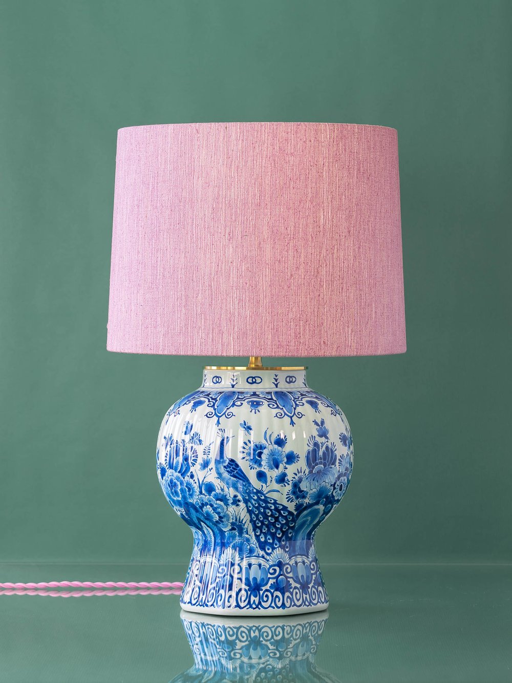 A Dutch Royal Delft lamp base with pink shade from Amitābha Studio.