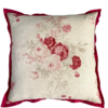 A large, square, vintage roses cushion in linen with a deep red silk trim.