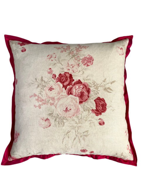 A large, square, vintage roses cushion in linen with a deep red silk trim.