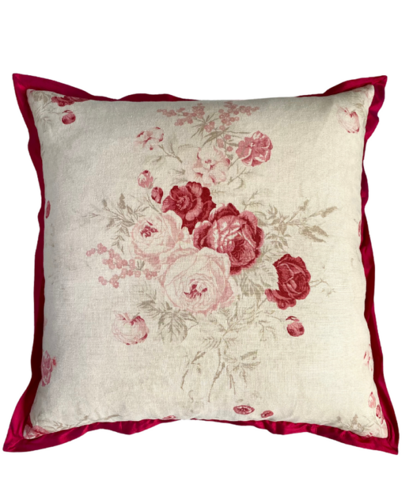 A large, square, vintage roses cushion in linen with a deep red silk trim.