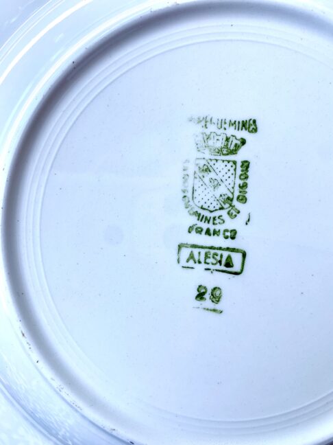 The manufacturer's back stamp on vintage French bowls.