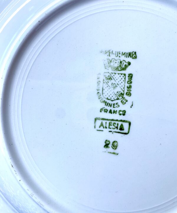 The manufacturer's back stamp on vintage French bowls.