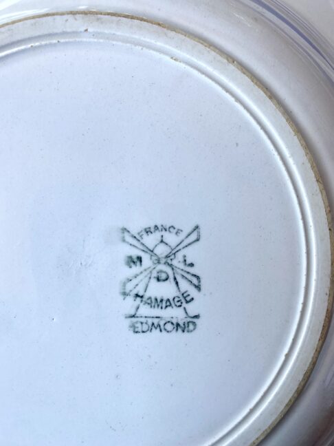 A windmill maker's mark on the back of French vintage bowls.