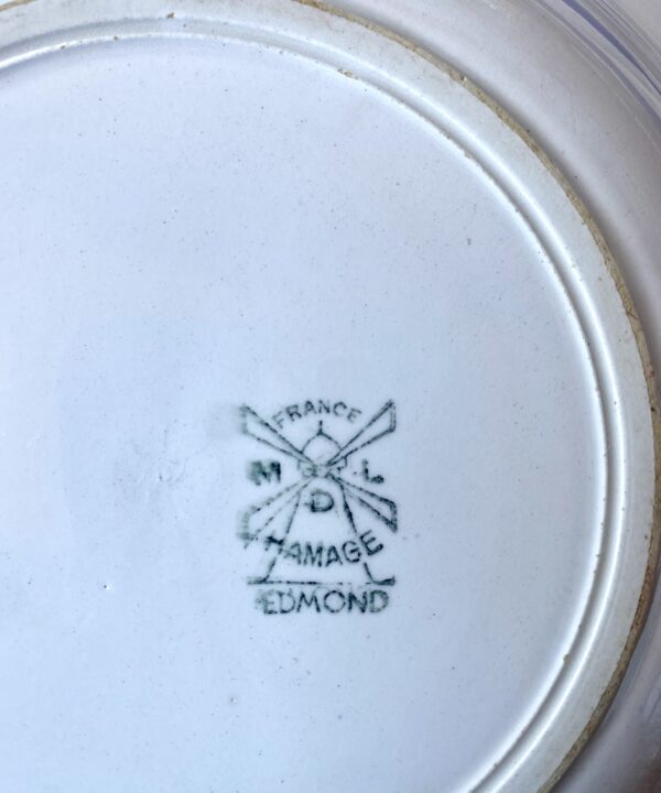 A windmill maker's mark on the back of French vintage bowls.