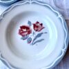 Pretty floral French dishes set in soft grey-blue with a blush red floral rose motif.