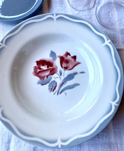 Pretty floral French dishes set in soft grey-blue with a blush red floral rose motif.