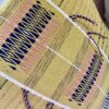 Acid yellow cushions with tassels handwoven in India.