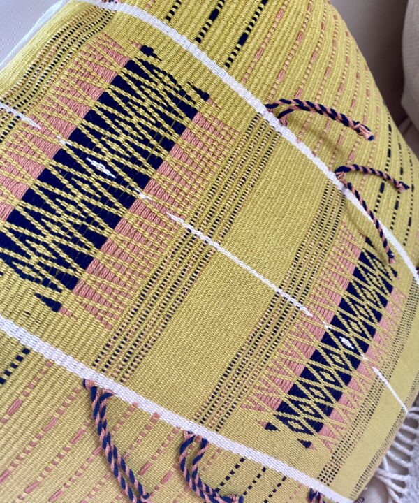 Acid yellow cushions with tassels handwoven in India.