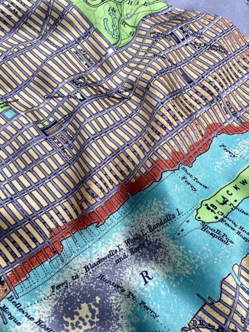 Detail of the gridded streets of Manhattan Island, New York City, on this luxury silk scarf.