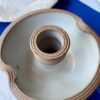 Ivory white candle holder in handmade, rustic pottery.