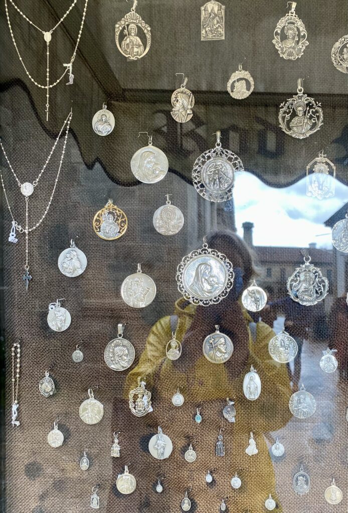 Silverworked jewellery, especially with religious emblems or motifs, is a traditional, regional craft in Santiago De Compostela, Galicia, Spain.