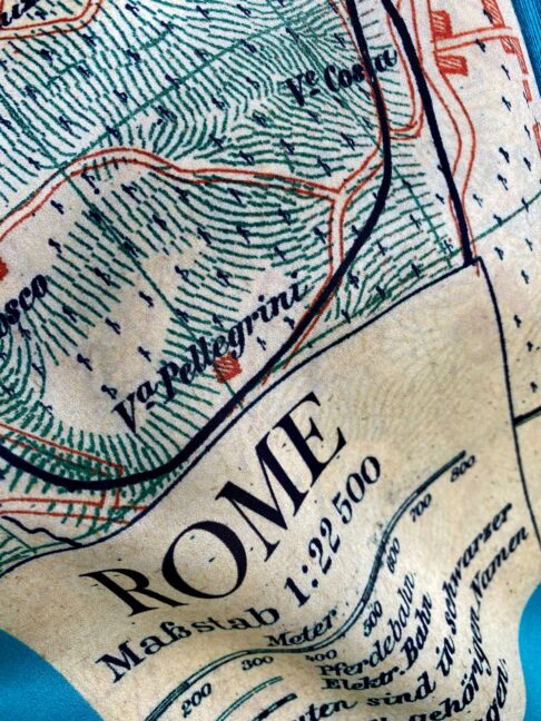 Close-up shot of a vintage Rome map silk scarf.