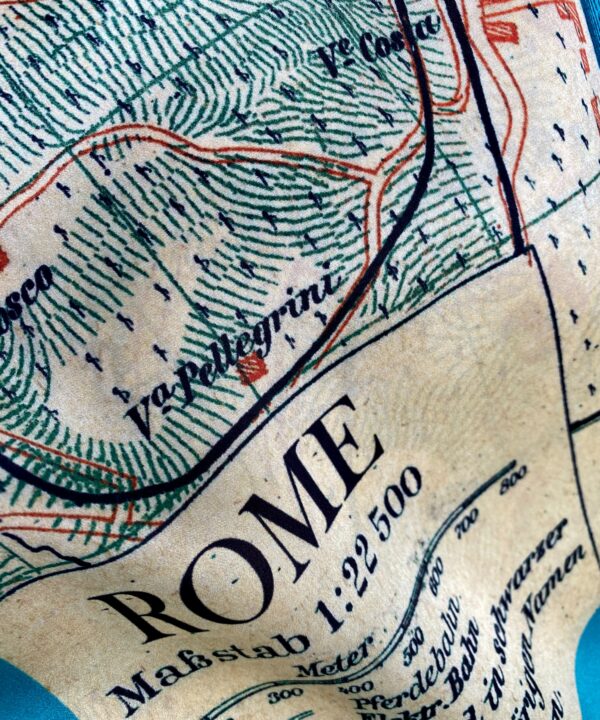 Close-up shot of a vintage Rome map silk scarf.