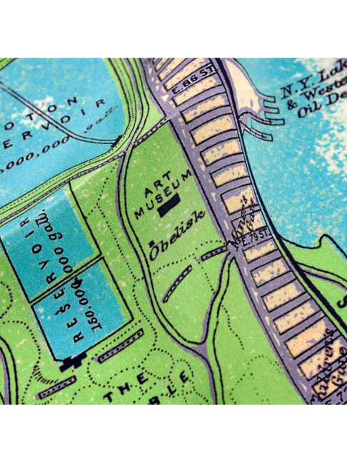 Detail of a luxurious, lilac silk scarf depicting a vintage map of New York City.