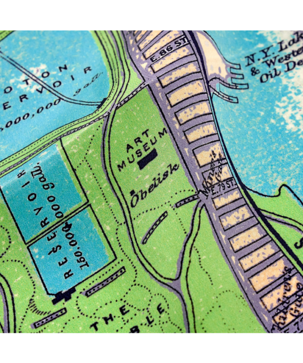Detail of a luxurious, lilac silk scarf depicting a vintage map of New York City.