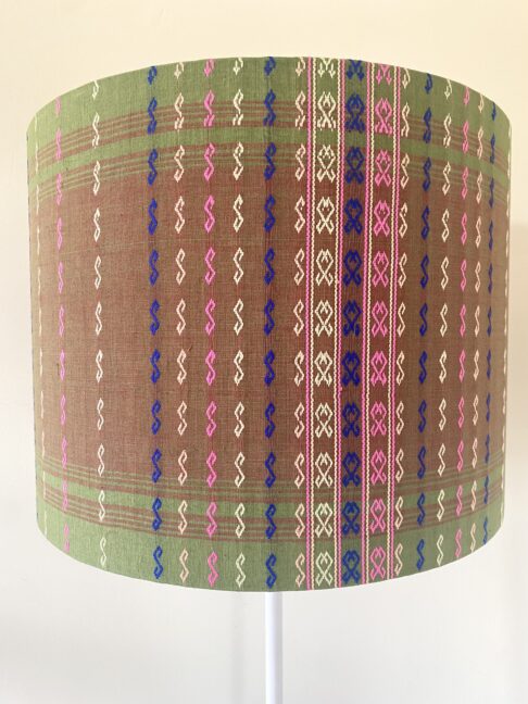 Patterned green lampshade with pink and blue stitch detail from our lamps and shades edit.