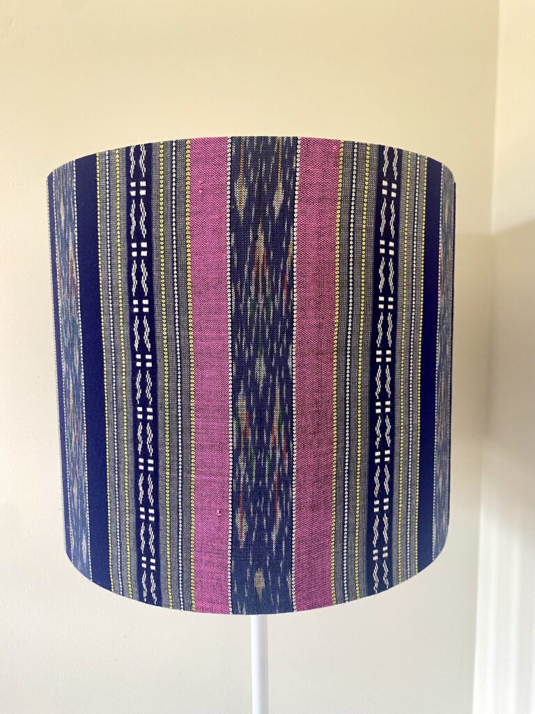Pink and navy lampshades in hand loomed Thai silk