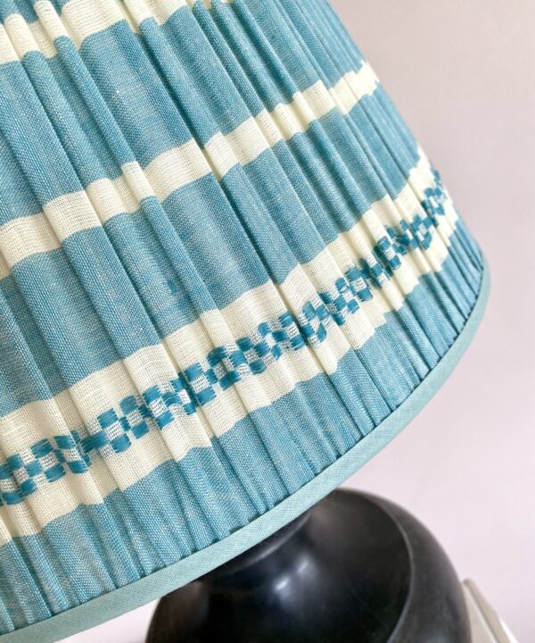 Pale blue gathered lampshades with a blue stripe design, handmade in India.