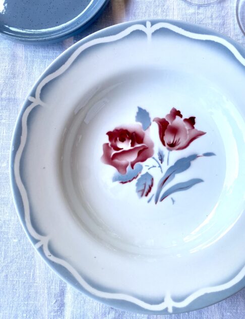 Vintage floral French dishes with a scalloped edge design and transferware floral rose motif.