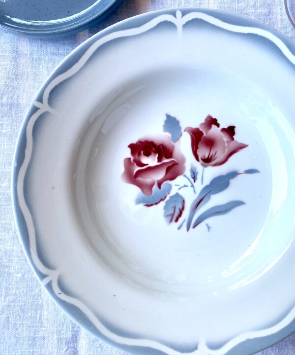 Vintage floral French dishes with a scalloped edge design and transferware floral rose motif.