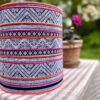 A drum lampshade handmade using a vintage Thai indigo print with pink and orange stripes.