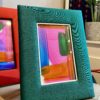 Photograph frames for walls and surfaces in colourful Thai silks.