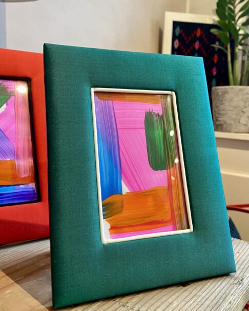 Photograph frames for walls and surfaces in colourful Thai silks.