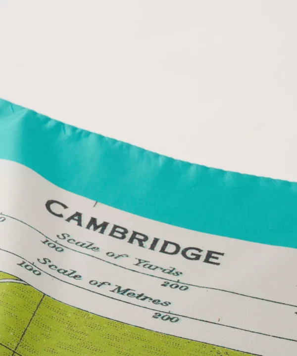 Detail on a luxury silk scarf depicting a vintage Cambridge map.