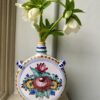 Vintage Portuguese bud vases with hand-painted decoration filled with seasonal Hellebores.