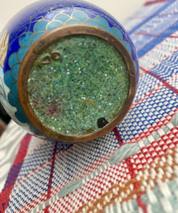 The base of a cloisonné decorated small metal pot.