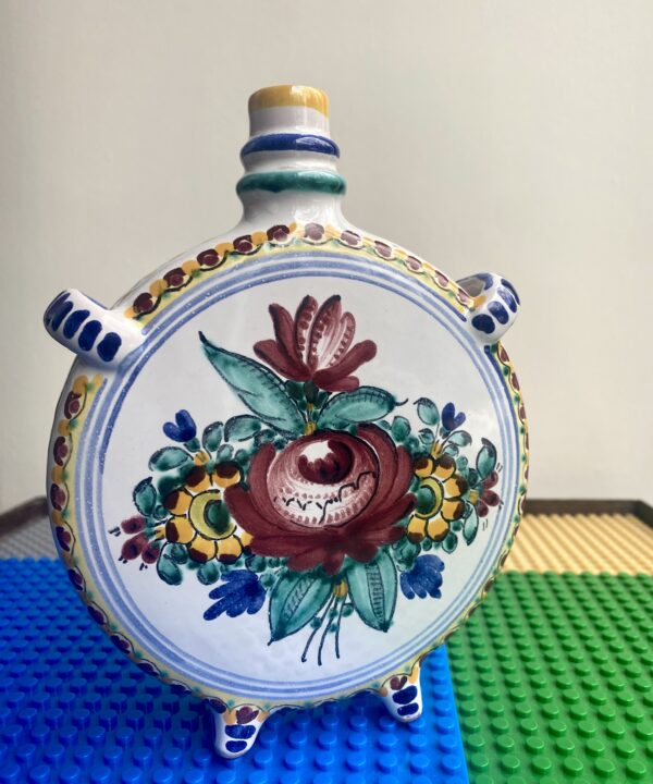 A beautiful, hand-painted rose on a Portuguese pottery vase.