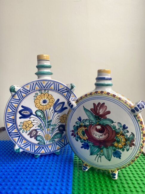 Portuguese pottery vases in unusual circular shapes and brightly, hand-painted colours.