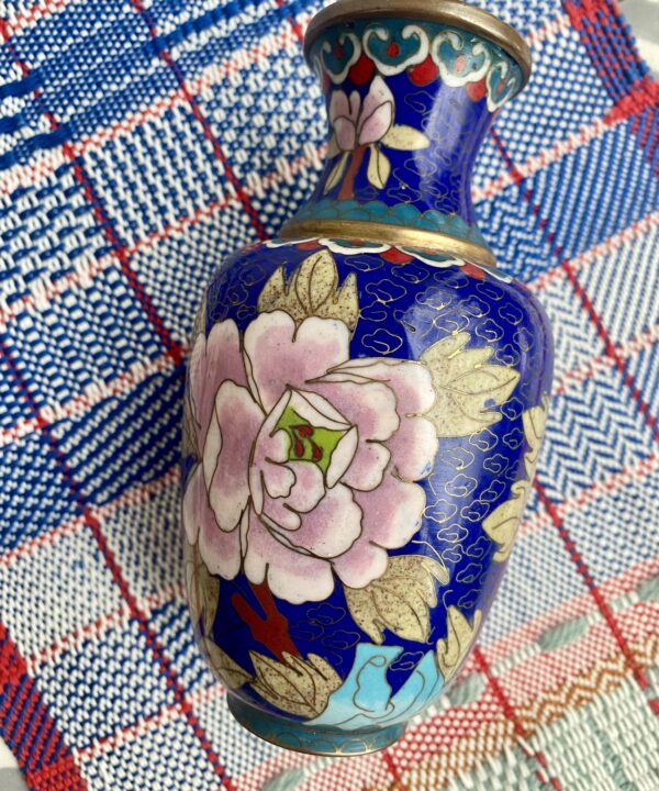 A pretty cloisonné metal pot with pretty, floral décor.