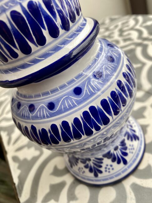 Detail of a handpainted, blue and white Mexican pot.