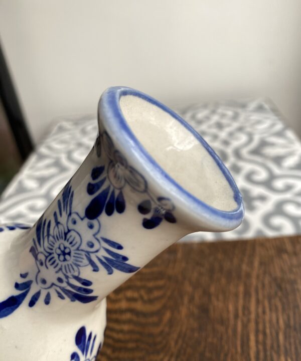 Delft vase in blue and white showing the neck detail.